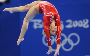 Gymnast performing on the beam