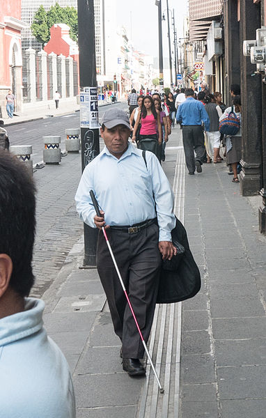 File:Blind man walking with a long cane.jpeg