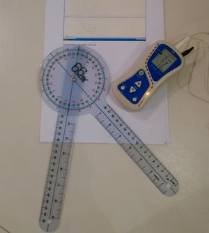 Photograph of goniometer, EMG graph and EMG unit