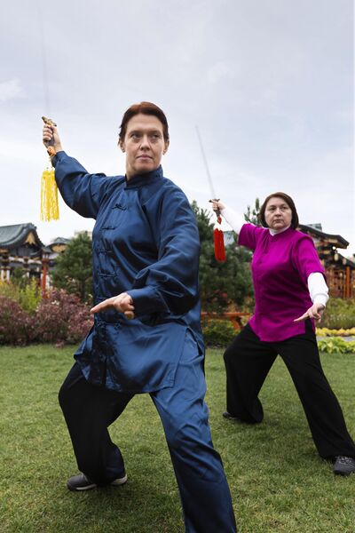File:Full-shot-women-practicing-tai-chi-outdoors-min-min.jpg