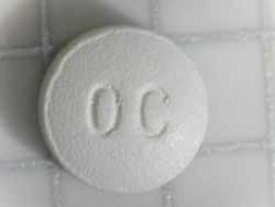 OxyContin branded oxycodone 10mg (OC side).jpg
