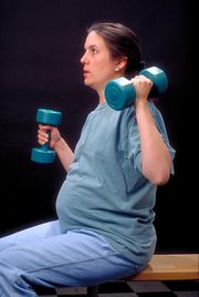 Pregnant Woman With Dumbells.jpeg